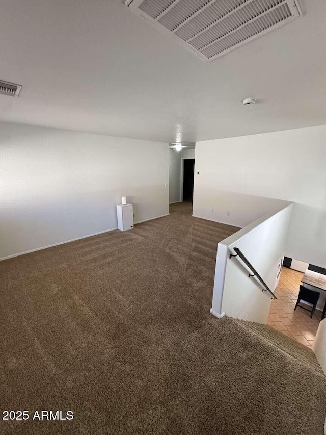 empty room featuring light colored carpet