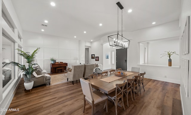 dining area featuring baseboards, wood finished floors, visible vents, and recessed lighting