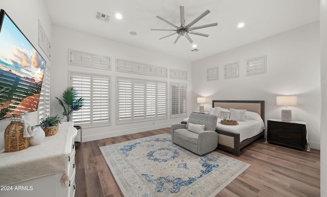 bedroom with wood-type flooring and ceiling fan