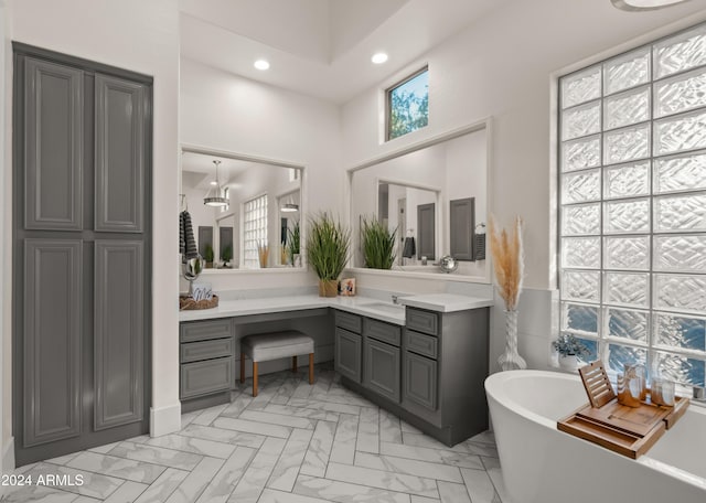 6429 S Honor Ct, Gilbert, AZ 85298 - bathroom with a freestanding tub, marble finish floors, vanity, recessed lighting, and a high ceiling