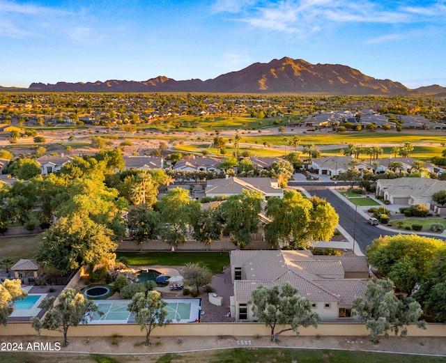 birds eye view of property with a mountain view