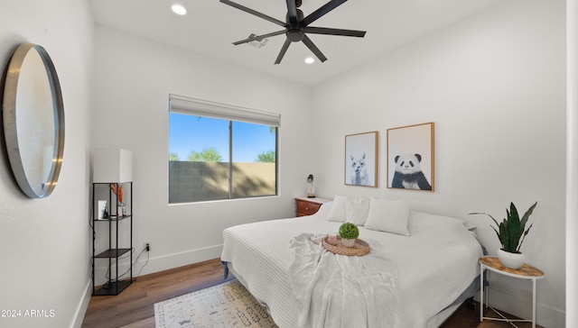 bedroom with wood-type flooring and ceiling fan