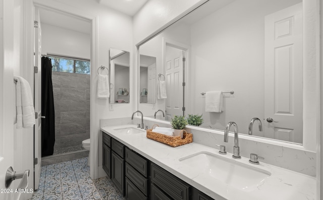 bathroom featuring vanity, walk in shower, toilet, and tile patterned floors