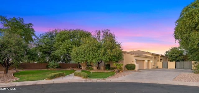 6429 S Honor Ct, Gilbert, AZ 85298 - obstructed view of property with an attached garage, driveway, a gate, stucco siding, and a tiled roof