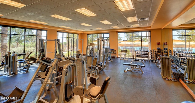 gym featuring visible vents and a paneled ceiling