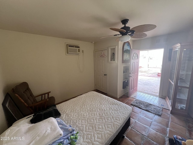 bedroom with ceiling fan and a wall unit AC