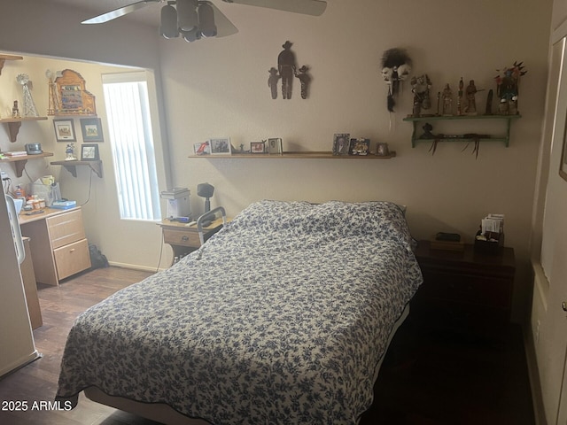 bedroom with hardwood / wood-style flooring and ceiling fan