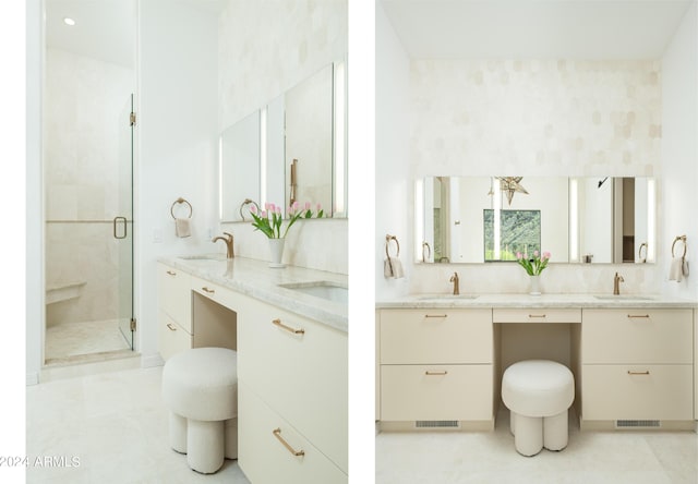 full bathroom featuring double vanity, a stall shower, and a sink