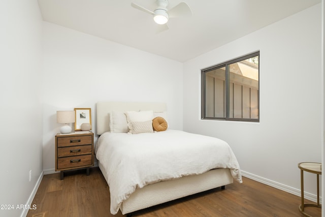 bedroom with wood finished floors, baseboards, and ceiling fan