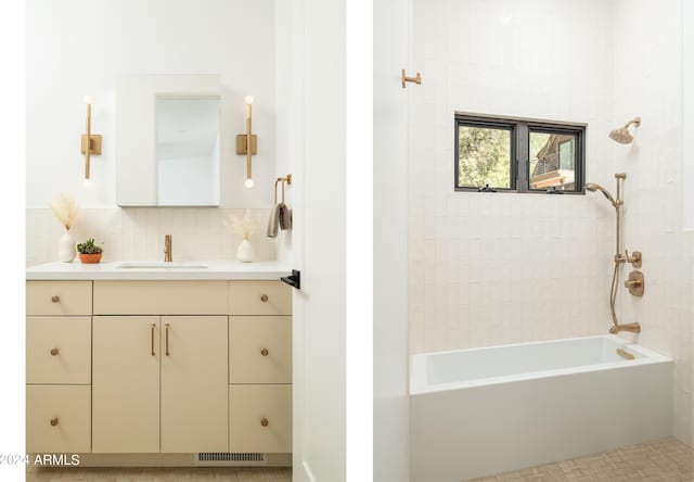 bathroom featuring vanity, bathtub / shower combination, visible vents, and backsplash