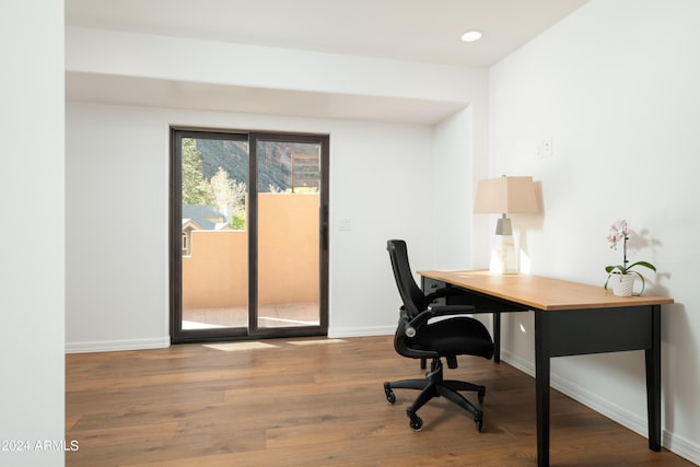 office featuring recessed lighting, wood finished floors, and baseboards