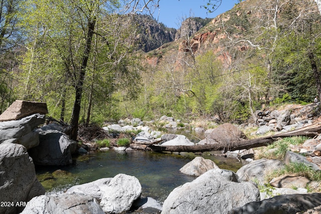 view of mountain feature with a view of trees