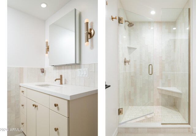 bathroom with recessed lighting, a stall shower, and vanity