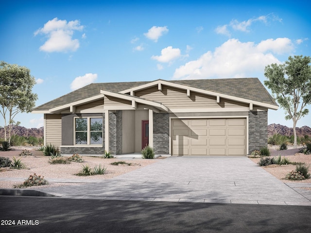 view of front of property featuring a mountain view and a garage