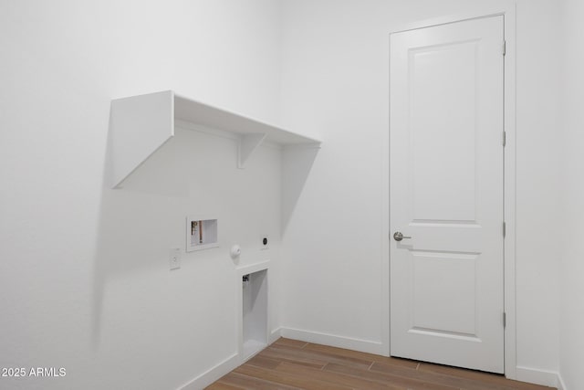 washroom featuring washer hookup, light wood-type flooring, hookup for a gas dryer, and hookup for an electric dryer