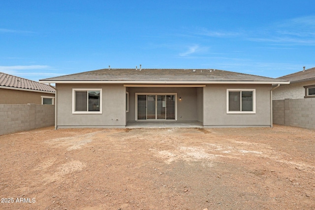 back of house with a patio