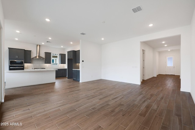 unfurnished living room featuring dark wood-type flooring