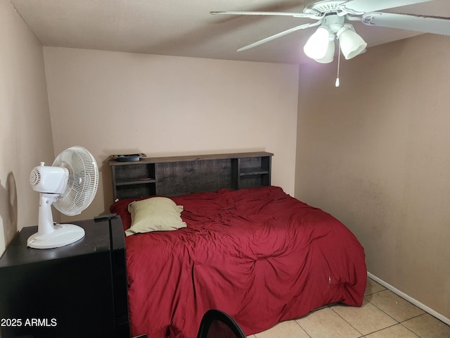 bedroom featuring a ceiling fan and tile patterned floors