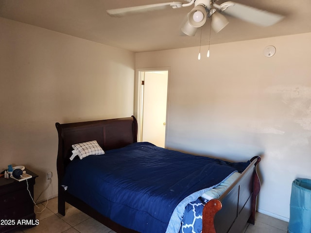 tiled bedroom featuring a ceiling fan