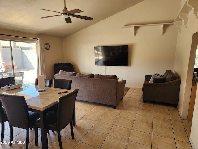 dining area featuring lofted ceiling, light tile patterned flooring, and ceiling fan