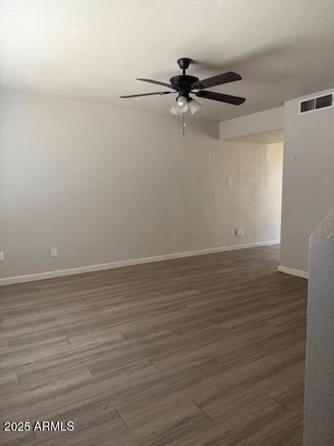 3840 N 43rd Ave Unit 16, Phoenix, AZ 85031 - unfurnished room featuring baseboards, visible vents, wood finished floors, and ceiling fan