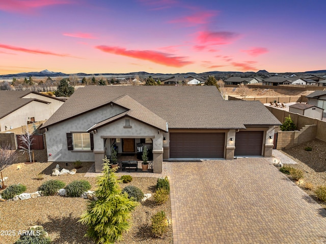 707 Lunar View Way, Chino Valley, AZ 86323 - single story home featuring an attached garage, stucco siding, decorative driveway, roof with shingles, and a residential view