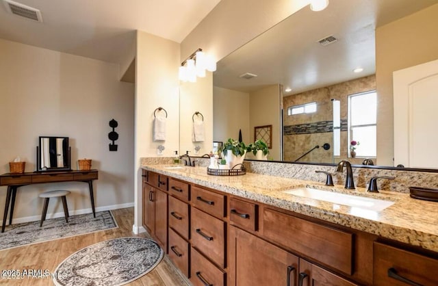 707 Lunar View Way, Chino Valley, AZ 86323 - bathroom featuring wood finished floors, double vanity, and walk in shower