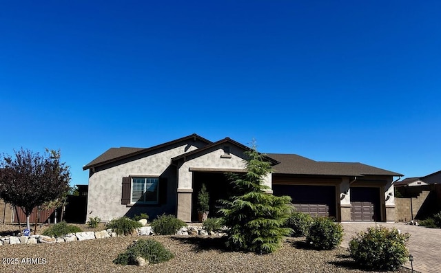 707 Lunar View Way, Chino Valley, AZ 86323 - ranch-style home with a garage, stucco siding, and decorative driveway