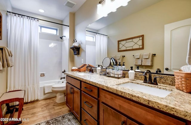 707 Lunar View Way, Chino Valley, AZ 86323 - bathroom featuring shower / bath combo, toilet, wood finished floors, and double vanity
