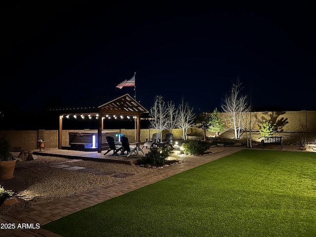 707 Lunar View Way, Chino Valley, AZ 86323 - yard at night featuring a hot tub, a gazebo, and a patio