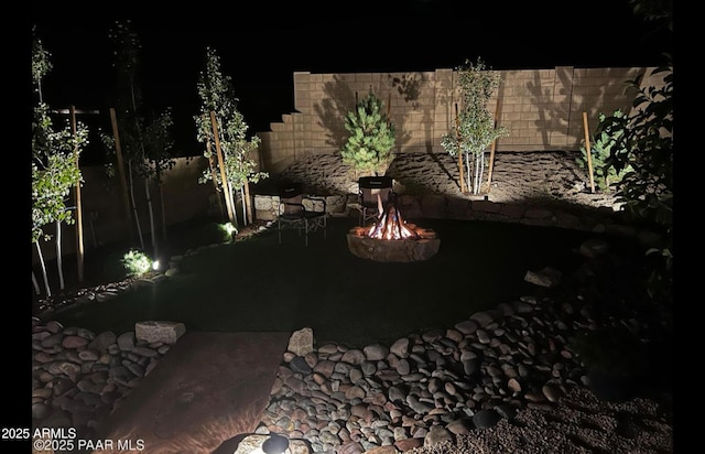 707 Lunar View Way, Chino Valley, AZ 86323 - yard at night with a fire pit and a patio area