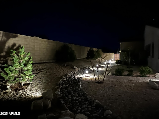 707 Lunar View Way, Chino Valley, AZ 86323 - yard at night with a fenced backyard and a patio