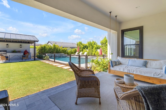 view of patio / terrace with a fenced in pool, an outdoor hangout area, and grilling area