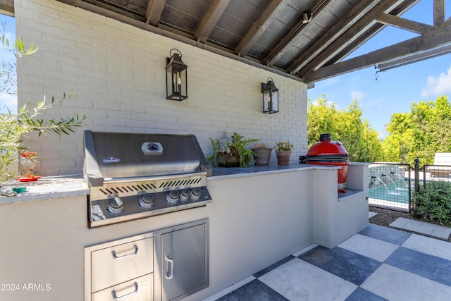 view of patio featuring an outdoor kitchen and area for grilling