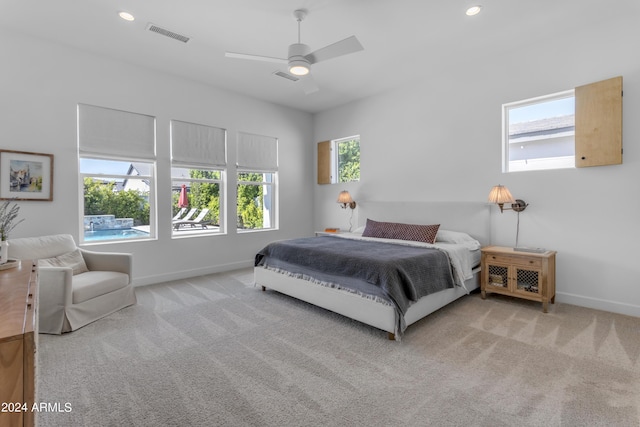 carpeted bedroom with ceiling fan