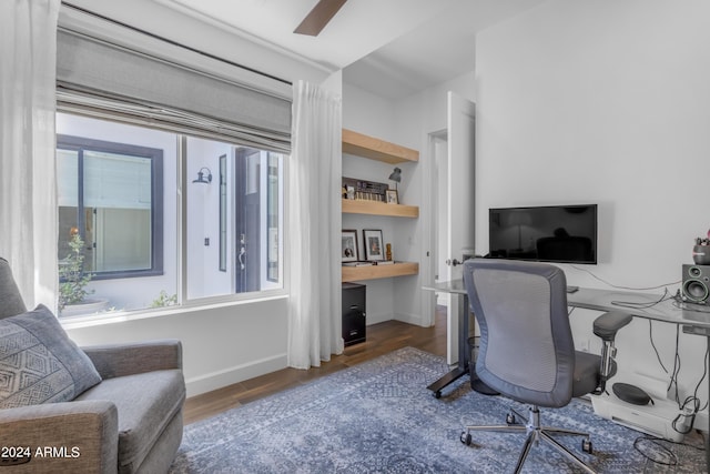 office area featuring ceiling fan and dark wood-type flooring