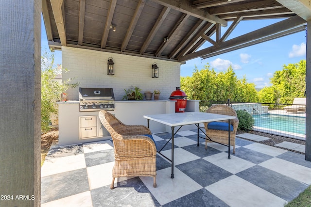 view of patio featuring an outdoor kitchen and grilling area