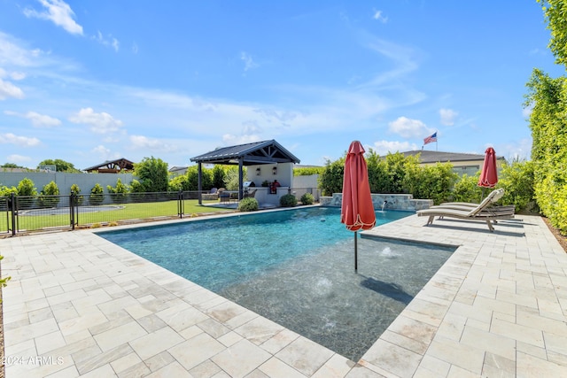 view of pool with a gazebo, pool water feature, and a patio