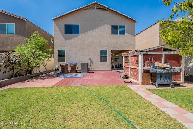 8905 W Jefferson St, Tolleson, AZ 85353 - rear view of house featuring stucco siding and a patio area
