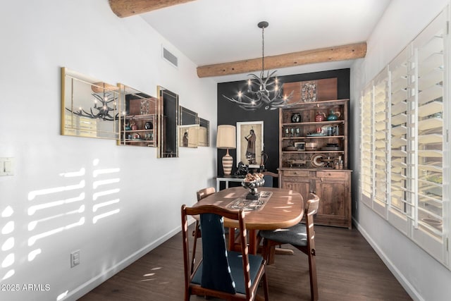 dining room featuring dark hardwood / wood-style floors, an inviting chandelier, and beam ceiling