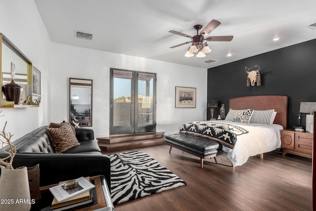 bedroom featuring dark hardwood / wood-style floors, ceiling fan, and french doors