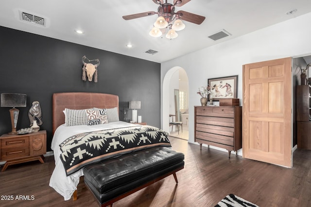 bedroom with dark wood-type flooring and ceiling fan