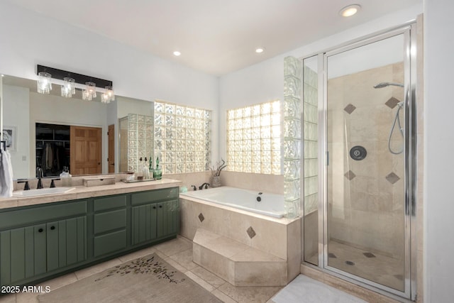 bathroom with vanity, tile patterned flooring, and separate shower and tub