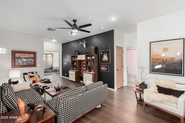 living room featuring dark hardwood / wood-style floors and ceiling fan