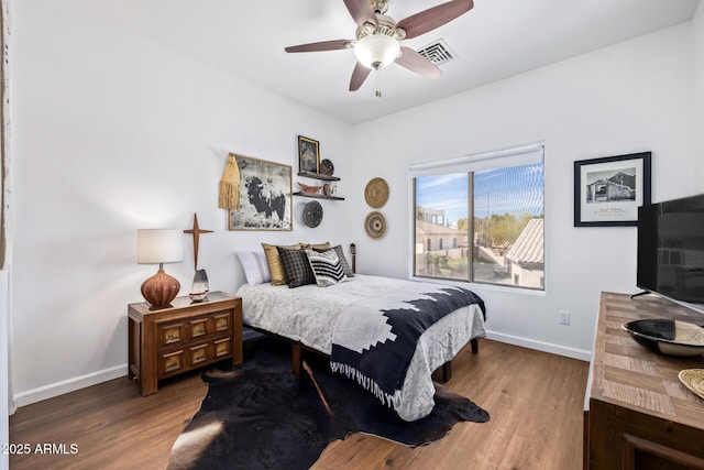 bedroom with hardwood / wood-style flooring and ceiling fan