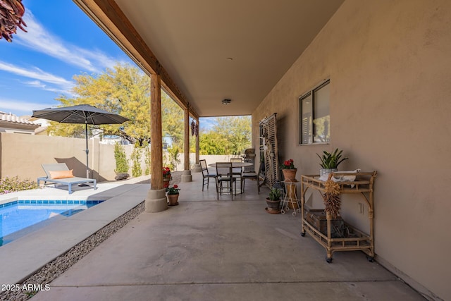 view of patio / terrace featuring a fenced in pool