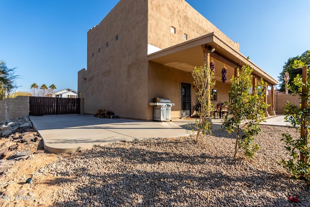 back of property with a patio area