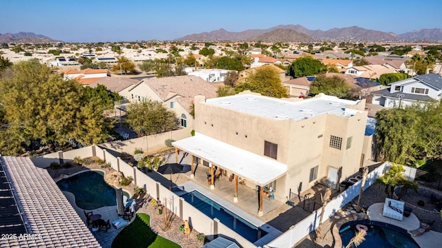 birds eye view of property featuring a mountain view