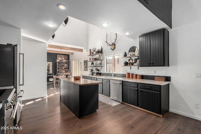 kitchen with sink, decorative light fixtures, dark hardwood / wood-style flooring, a kitchen island, and stainless steel appliances