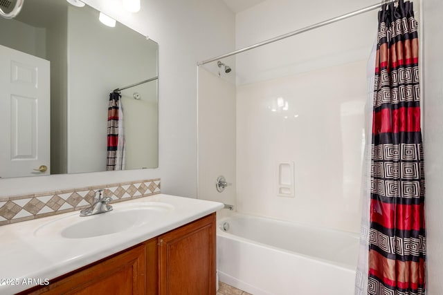bathroom featuring vanity, backsplash, and shower / bath combo
